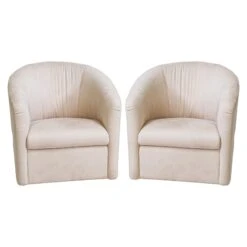 Pair Of Tan Natuzzi Swivels